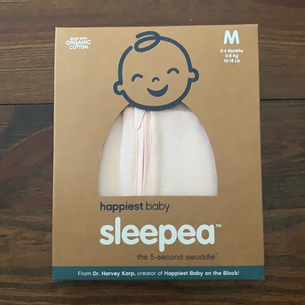 NEW!! Sleepea swaddle. Light pink, box has never been opened.